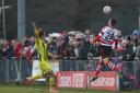 Kingstonian left-back Fabio Saraiva heads the ball at a sold-out King George's Field on Saturday. Pic: Simon Roe.