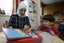 Back to school: Afrah Al-Maliki with her son Ameen