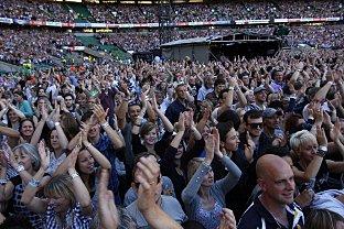 The 60,000-strong crowd cheer the acts on stage at Twickenham