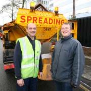 Spreading the love: Gritting lorry driver Colin Magellan, left, with our reporter Chris Wickham