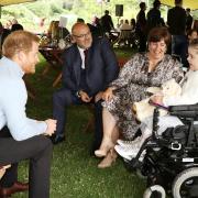 Prince Harry speaking to Inspirational Child award winner Carmela Chilery-Watson