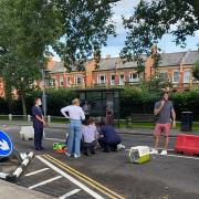 A woman on an electric scooter collided with a car yesterday in Barnes.