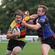 Out of my way: Cinderford's Steffan Hawley struggles to get to grips with Richmond winger Will Browne
