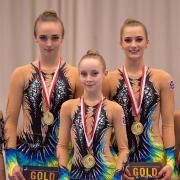 Golden girls: RGA's Tabbie Dawson, Kitty Williams and Scarlett Wright with their Flanders International Acro Cup gold medals