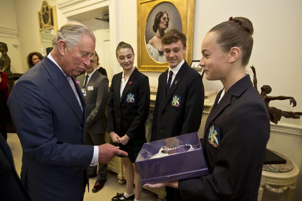 Prince Charles speaking with Lydia Brayshaw, who presented him with a pair of pointe shoes for the Queen