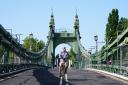 Cyclists and pedestrians return to Hammersmith Bridge after safety checks (PA)