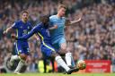 Chelsea's Antonio Rudiger (left) tackles Manchester City's Kevin De Bruyne during the Premier League match at Etihad Stadium, Manchester.