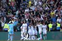 Brentford's players celebrate scoring late on to beat Watford