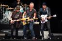 Bruce Springsteen (centre) with E Street Band members Nils Lofgren and Steve Van Zandt on the Oak Stage at BST Hyde Park on July 8