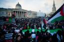 People at a rally in Trafalgar Square, London, during Stop the War coalition's call for a Palestine ceasefire