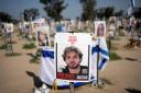 A poster depicting Israeli hostage Alon Ohel is displayed in Re’im, southern Israel, at the Gaza border on Monday (Maya Alleruzzo/AP)