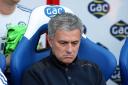 Cheer up: Chelsea boss Jose Mourinho has looked downbeat despite a first win of the season.