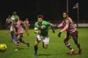 Corinthian-Casuals (pink shirts) gave a spirited performance against Dulwich Hamlet on Tuesday night. Picture: Stuart Tree