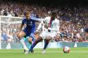 One of the three: Chelsea's Nemanja Matic shadows Crystal Palace winger Wilfried Zaha