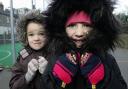 Brrrr: Ellen Greenbank, five, (right) and Georgia Lewis, four, both pupils at Darrell Primary School, Kew, prepare for the big chill