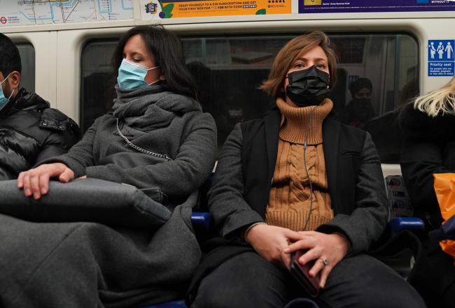 People wearing masks traveling on the London Underground. Image: Stefan Rousseau/PA