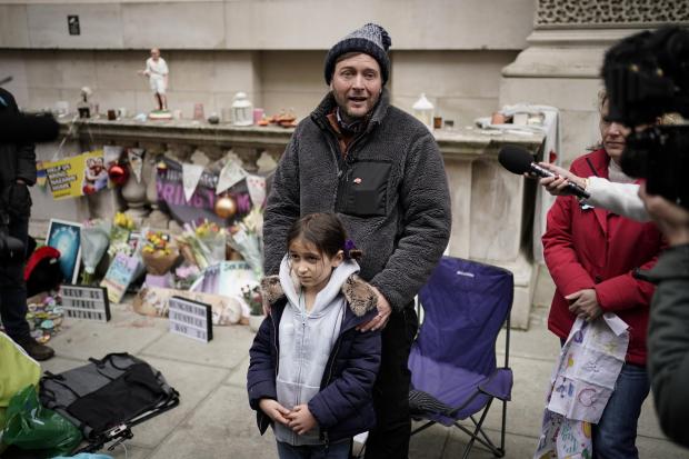 Richmond and Twickenham Times: Richard Ratcliffe, the husband of Iranian detainee Nazanin Zaghari-Ratcliffe, with his daughter Gabriella, he is ending his hunger strike in central London after almost three weeks. Credit: PA