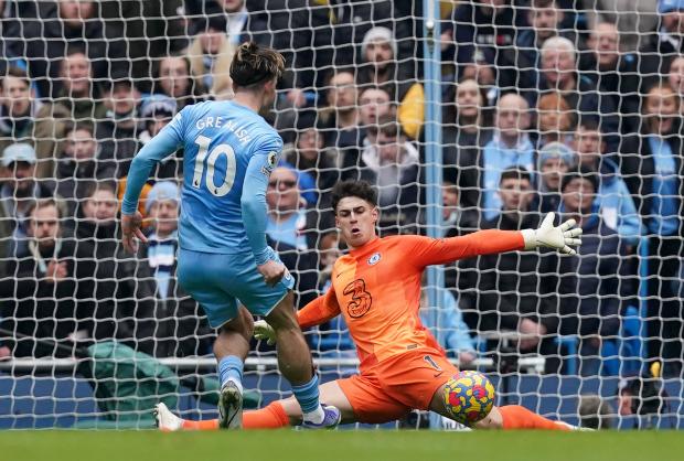 Richmond and Twickenham Times: Chelsea goalkeeper Kepa Arrizabalaga makes a save from Manchester City's Jack Grealish during the Premier League match at Etihad Stadium, Manchester.