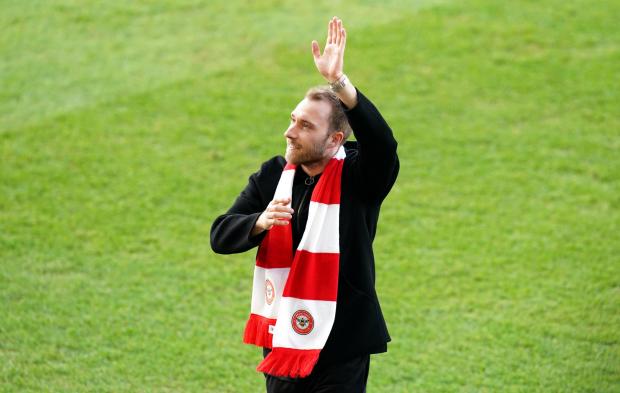 Richmond and Twickenham Times: Brentford's Christian Eriksen waves to the fans prior to during the Premier League match at the Brentford Community Stadium, London.