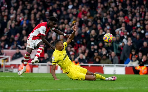 Richmond and Twickenham Times: Arsenal's Bukayo Saka scoring the second goal during the Premier League match at the Emirates Stadium, London