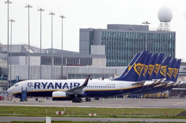 Holidaymakers will face rising prices and an airport delays (Niall Carson/PA)
