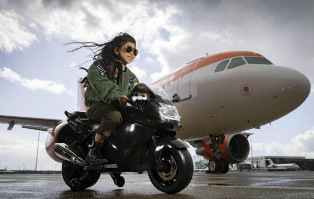 Richmond and Twickenham Times: Rei Diec, aged 7 during filming of a parody of the movie Top Gun at Luton airport as part of easyJet's nextGen recruitment campaign. Credit: PA/easyJet