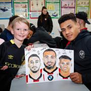 Young Brentford fans meet their footballing heroes