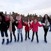 Icy fun: Ice skaters at Hampton Court Palace make the most of the wintry weather