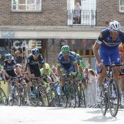 Taking it easy: Tour de France winner Chris Froomer (second from left) in action on the streets of Leatherhead