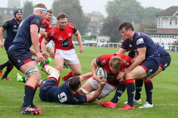 Powering through: Joshua Mc Nally, second from right, breaks through the London Scottish ranks to touch down for London Welsh during Saturday’s one-sided affair at the Athletic Ground